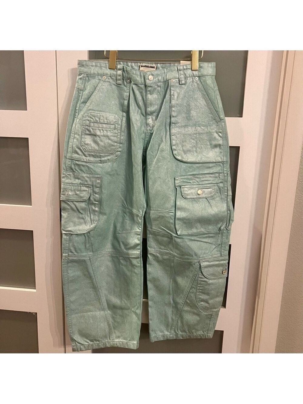 WE THE FREE Free People Lap of Luxury metallic barrel cargo jeans. Size 31